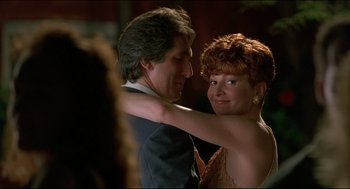 Movie still from “My Father the Hero” (1994), directed by Steve Miner – A man and a woman dancing together in a room; Close Up shot, Over the shoulder angle