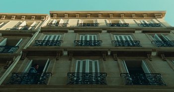 Movie still from “My Father's Glory” (1990), directed by Yves Robert – A very tall building with many balconies on it's side; Extreme Wide shot, Low angle