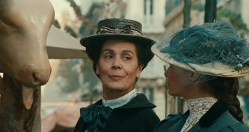 Movie still from “My Father's Glory” (1990), directed by Yves Robert – Two women wearing hats and a bow tie; Close Up shot, Over the shoulder angle