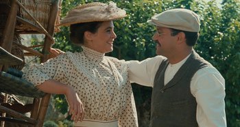 Movie still from “My Father's Glory” (1990), directed by Yves Robert – A man and a woman standing next to each other; Medium shot, Low angle