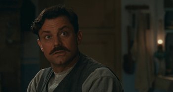 Movie still from “My Father's Glory” (1990), directed by Yves Robert – A person with a mustache; Close Up shot, Low angle