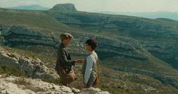Movie still from “My Father's Glory” (1990), directed by Yves Robert – Two young boys standing on top of a mountain; Wide shot, High angle