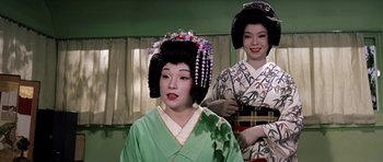 Movie still from “My Geisha” (1962), directed by Jack Cardiff – Two geishas are dressed in traditional clothing; Close Up shot, Low angle