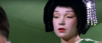 Movie still from “My Geisha” (1962), directed by Jack Cardiff – The face of a geisha doll; Extreme Close Up shot, Over the shoulder angle