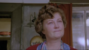 Movie still from “My Left Foot” (1989), directed by Jim Sheridan – A person looking up at something; Close Up shot, Low angle