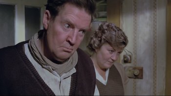 Movie still from “My Left Foot” (1989), directed by Jim Sheridan – A man and a woman standing next to each other in a room; Close Up shot, High angle