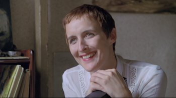 Movie still from “My Left Foot” (1989), directed by Jim Sheridan – A person wearing a shirt and tie; Close Up shot, High angle