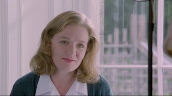 Movie still from “My Left Foot” (1989), directed by Jim Sheridan – A person wearing a sweater; Close Up shot, Low angle