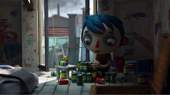 Movie still from “My Life as a Zucchini” (2016), directed by Claude Barras – A giant head is sitting on the floor near cans of beer; Wide shot, High angle
