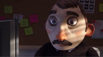 Movie still from “My Life as a Zucchini” (2016), directed by Claude Barras – The face of a man wearing a fake mustache; Close Up shot, Over the shoulder angle