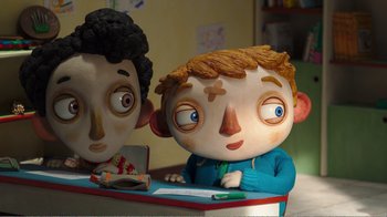 Movie still from “My Life as a Zucchini” (2016), directed by Claude Barras – A sculpture of a boy and a girl; Medium shot, Over the shoulder angle