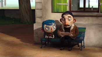 Movie still from “My Life as a Zucchini” (2016), directed by Claude Barras – A couple of characters sitting on top of a wooden bench; Wide shot, High angle