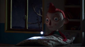 Movie still from “My Life as a Zucchini” (2016), directed by Claude Barras – A stuffed doll is sitting on a bed; Medium shot, Over the shoulder angle
