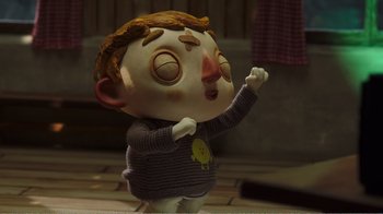 Movie still from “My Life as a Zucchini” (2016), directed by Claude Barras – A cartoon character is standing on a table; Medium shot, Low angle