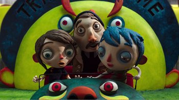 Movie still from “My Life as a Zucchini” (2016), directed by Claude Barras – A group of people that are sitting in a car; Medium shot, Overhead angle