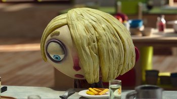 Movie still from “My Life as a Zucchini” (2016), directed by Claude Barras – A woman's head made out of a head of lettuce; Close Up shot, High angle