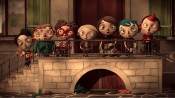 Movie still from “My Life as a Zucchini” (2016), directed by Claude Barras – A group of people standing next to each other on top of a balcony; Wide shot, Overhead angle
