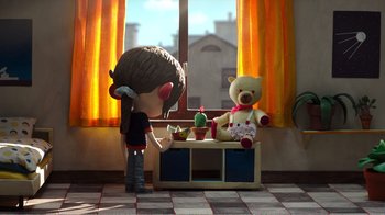 Movie still from “My Life as a Zucchini” (2016), directed by Claude Barras – A girl is standing next to a teddy bear in front of a window; Wide shot, Over the shoulder angle