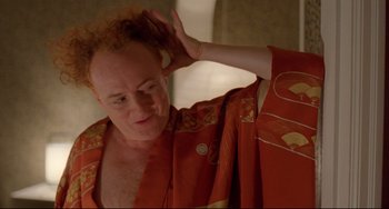 Movie still from “My Own Private Idaho” (1991), directed by Gus Van Sant – A man in a robe is looking in the mirror; Close Up shot, Over the shoulder angle