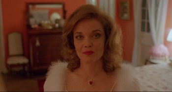 Movie still from “My Own Private Idaho” (1991), directed by Gus Van Sant – A person wearing a necklace; Close Up shot, Low angle