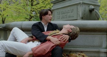 Movie still from “My Own Private Idaho” (1991), directed by Gus Van Sant – A man holding another man on the ground; Wide shot, Overhead angle