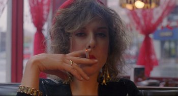Movie still from “My Own Private Idaho” (1991), directed by Gus Van Sant – A woman is smoking a cigarette in a restaurant; Close Up shot, Over the shoulder angle