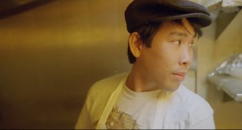 Movie still from “My Own Private Idaho” (1991), directed by Gus Van Sant – A young man wearing a hat and looking to his left; Close Up shot, Low angle