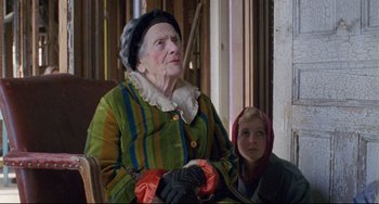 Movie still from “My Own Private Idaho” (1991), directed by Gus Van Sant – An old woman and a young girl sitting in a chair; Medium shot, Over the shoulder angle