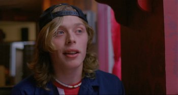 Movie still from “My Own Private Idaho” (1991), directed by Gus Van Sant – A young man with blonde hair wearing a baseball cap; Close Up shot, Low angle