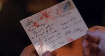 Movie still from “My Own Private Idaho” (1991), directed by Gus Van Sant – A person holding an envelope that has blood on it; Extreme Close Up shot, High angle