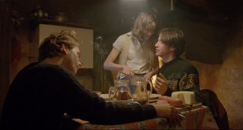 Movie still from “My Own Private Idaho” (1991), directed by Gus Van Sant – A group of people sitting around a table; Medium shot, Over the shoulder angle