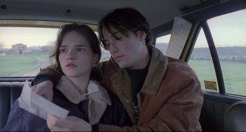 Movie still from “My Own Private Idaho” (1991), directed by Gus Van Sant – A man and a woman sitting in the back seat of a car; Close Up shot, Low angle