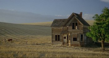 Movie still from “My Own Private Idaho” (1991), directed by Gus Van Sant – An old abandoned house in the middle of a field; Extreme Wide shot, Low angle