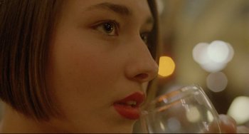 Movie still from “My Own Private Idaho” (1991), directed by Gus Van Sant – A person drinking a glass of wine; Extreme Close Up shot, Over the shoulder angle