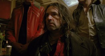 Movie still from “My Own Private Idaho” (1991), directed by Gus Van Sant – A person with long hair; Close Up shot, Low angle