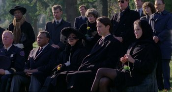 Movie still from “My Own Private Idaho” (1991), directed by Gus Van Sant – A group of people sitting on a bench in a park; Medium shot, Low angle