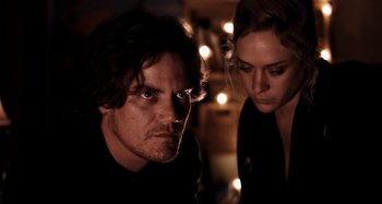 Movie still from “My Son, My Son, What Have Ye Done” (2009), directed by Werner Herzog – A man and a woman looking at each other; Close Up shot, Low angle