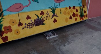 Movie still from “My Son, My Son, What Have Ye Done” (2009), directed by Werner Herzog – A wall with a painting on the side of a building; Wide shot, High angle
