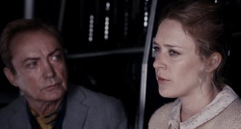 Movie still from “My Son, My Son, What Have Ye Done” (2009), directed by Werner Herzog – A woman and a man are looking at each other; Close Up shot, Over the shoulder angle