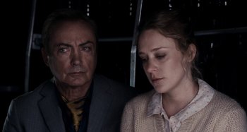 Movie still from “My Son, My Son, What Have Ye Done” (2009), directed by Werner Herzog – A man and a woman standing next to each other; Close Up shot, Over the shoulder angle