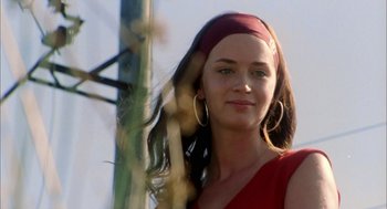 Movie still from “My Summer of Love” (2004), directed by Pawel Pawlikowski – A beautiful young lady in a red dress; Close Up shot, Low angle