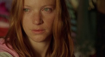 Movie still from “My Summer of Love” (2004), directed by Pawel Pawlikowski – A woman's face with green eyes; Close Up shot, Over the shoulder angle
