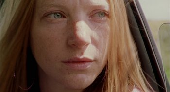 Movie still from “My Summer of Love” (2004), directed by Pawel Pawlikowski – A woman's face with green eyes; Close Up shot, Low angle