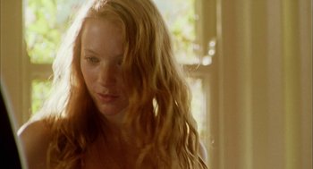 Movie still from “My Summer of Love” (2004), directed by Pawel Pawlikowski – A beautiful young woman with long , blonde hair; Close Up shot, Low angle