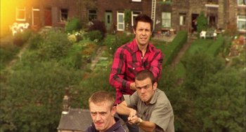 Movie still from “My Summer of Love” (2004), directed by Pawel Pawlikowski – A group of men standing on top of each other; Wide shot, High angle
