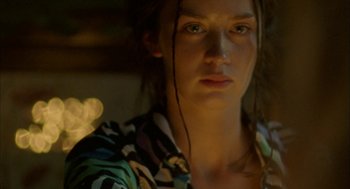 Movie still from “My Summer of Love” (2004), directed by Pawel Pawlikowski – A person wearing a colorful shirt; Close Up shot, Over the shoulder angle