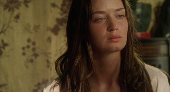 Movie still from “My Summer of Love” (2004), directed by Pawel Pawlikowski – A person with long brown hair; Close Up shot, Over the shoulder angle