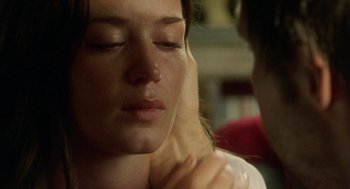 Movie still from “My Summer of Love” (2004), directed by Pawel Pawlikowski – A person with their eyes closed; Close Up shot, Over the shoulder angle