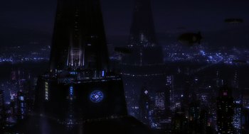 Movie still from “Mystery Men” (1999), directed by Kinka Usher – A view of a city at night from a skyscraper; Extreme Wide shot, Low angle