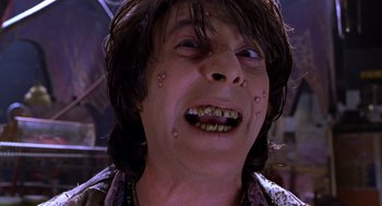 Movie still from “Mystery Men” (1999), directed by Kinka Usher – A person with a mouth open; Close Up shot, Low angle